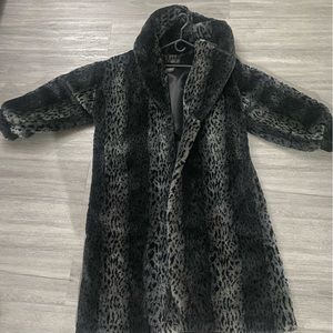 Luxury Faux Fur Coat needs to be dry cleaned.